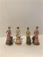 4 Figurines of Nicely Dressed Women
