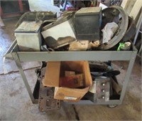 Metal shop cart with various batteries and old