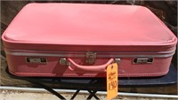 Large pink vintage suitcase