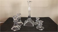 Glass candle stick holders 
Tall one has a