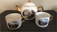 Thomas Kinkade Teapot & 2 cups 

Teapot has some
