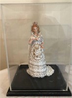 Porcelain figurine in plexiglass case