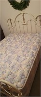 Metal scrollwork queen sized bed with mattress