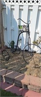 Wrought iron style yard art tricycle plant stand