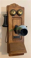 Antique oak case wall telephone by the Chicago