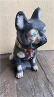 Antique concrete bulldog with a red and yellow