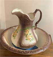 Antique ceramic wash bowl and pitcher with