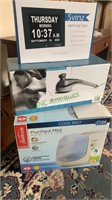 Three boxed items - Cool Mist humidifier, handheld