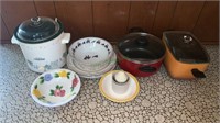 Rival crockpot, kitchen plates and bowls and two
