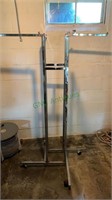 Four rod metal clothes rack on caster wheels -
