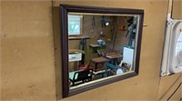 Wood framed wall mirror measures 32 x 24