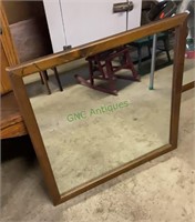 Square wood framed mirror measures 26 x 26