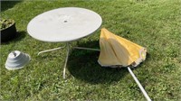 Vintage metal patio table with umbrella and