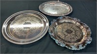 Three silver plated servers trays