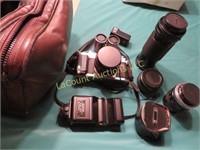 Canon film camera and assorted lenses in case