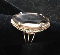 14kt gold ladies ring set with a large Topaz.