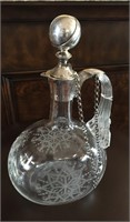 Etched crystal carafe with a Dutch sterling silve.
