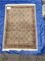 Persian wool carpet in creams and gold