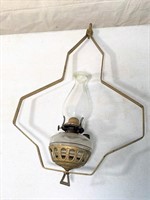 antique oil lamp on bracket