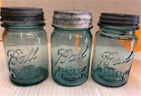 three pint size blue ball jars with zinc lids