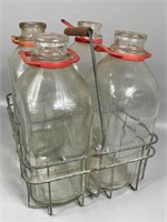 Four Vintage Half Gal Milk Bottles & Carrier