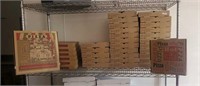 shelf of new pizza boxes
