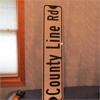 Metal County line road sign.