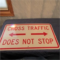 Metal Cross traffic does Not stop sign.