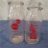 (2)Glass milk bottles. Bancroft, Carnation.