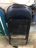 Two black folding chairs