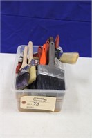 Assorted paint brushes and rollers
