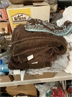 brown and bluish towels bath rug