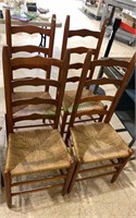 4 matching ladderback dining chairs with woven