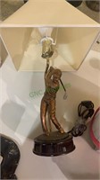 Golfer swinging a golf club table lamp with the