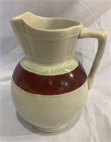 Small semi granite ware water pitcher with a