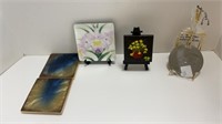 Assorted coasters, painted canvas on easel,