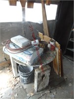Round table, misc wood pcs, bag of cement & other-