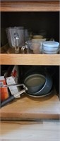 MEASURING CUPS; STRAINERS; IN CUPBARD BASE BESIDE