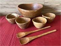 Wooden salad bowl and utensils