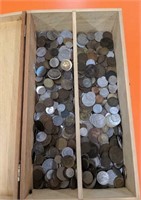 Wooden box full of old coins