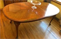 Formal dining table with cabriole legs with two