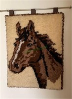 Hooked rug horse wall hanger - in the hallway -