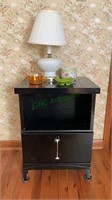 Black painted one drawer side table with a milk