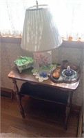 Small table stand with a lamp, green covered box,