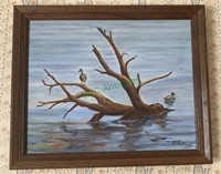 Framed oil painting of two ducks on a piece of