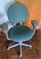 Green and gray office chair on caster wheels with