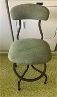 One metal green upholstered stool with round
