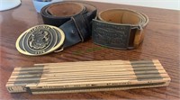 Two brass belt buckles and leather belts, one