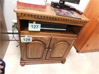 Small wooden entertainment center / rotating top,