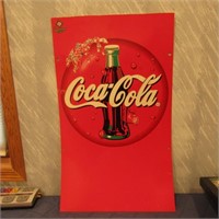 Plastic coca cola sign.
